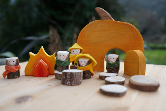 Wooden Pumpkin house with people.